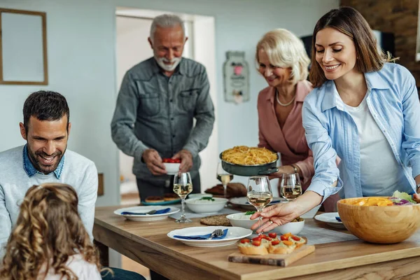 Multi Generation Family Having Lunch Together Home Focus Smiling Woman — Foto Stock