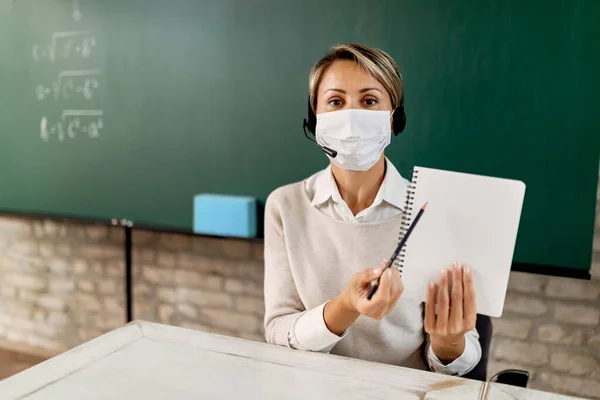Female Teacher Wearing Protective Face Mask While Making Conference Call — Stok Foto