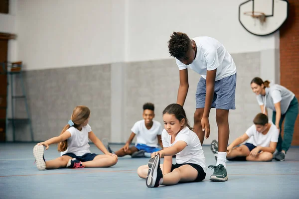 African American Boy Assisting His Friend Stretching Exercise Physical Education — Foto de Stock