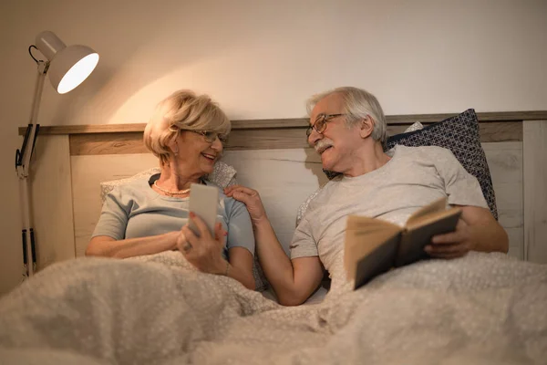 Happy Senior Couple Resting Bedroom Evening Talking Each Other Woman — Photo