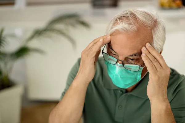 Worried Mature Man Having Headache While Wearing Protective Face Mask — 스톡 사진