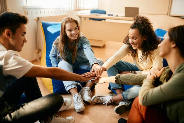 Multiracial Group Teenagers Uniting Hands While Celebrating Friendship Classroom — Fotografia de Stock