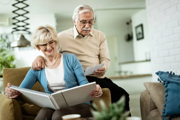 Happy Senior Woman Her Husband Looking Old Family Photos While — Photo