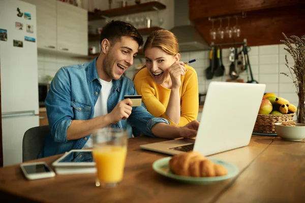 Young Happy Couple Using Laptop Credit Card While Shopping Internet — Photo