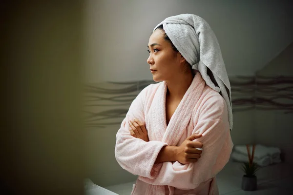 Young Distraught Asian Woman Bathrobe Standing Bathroom Thinking Something Copy — Stockfoto