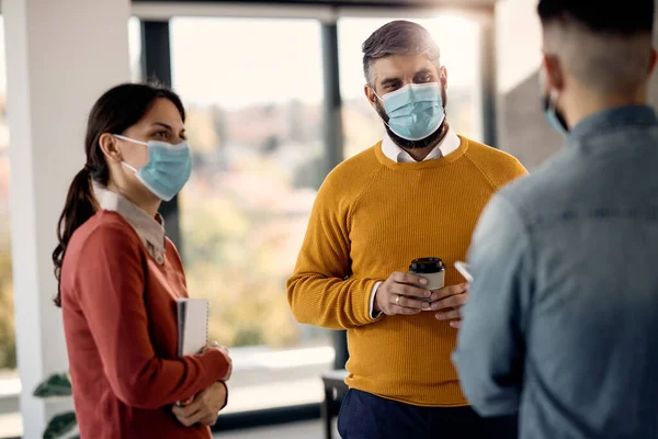 Group Coworkers Wearing Protective Face Masks While Talking Break Office — 스톡 사진