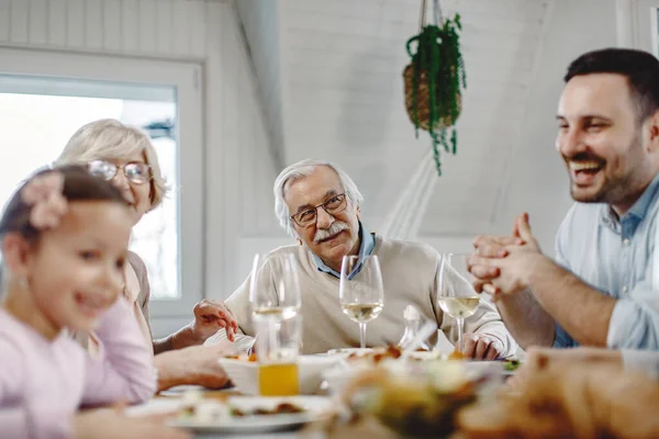 Extended Family Having Lunch Together Dining Room Focus Senior Man — Foto Stock