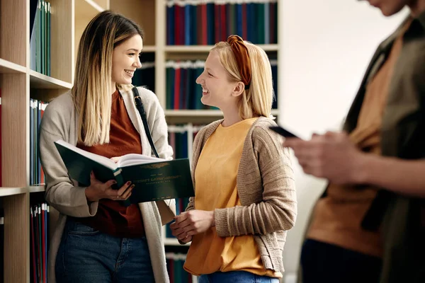 Happy Female Friends Communicating While Studying Together University Library — Stok Foto