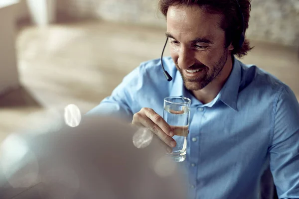 Young Happy Businessman Drinking Water While Working Office — Photo