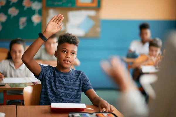 African American Schoolboy Raising His Arm Answer Teacher Question Class — Stock Fotó