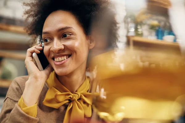 Happy Black Woman Talking Someone Mobile Phone Home — Zdjęcie stockowe