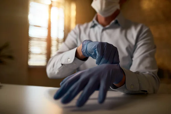 Close Businessman Putting Protective Gloves While Working Coronavirus Epidemic Office — Stock fotografie
