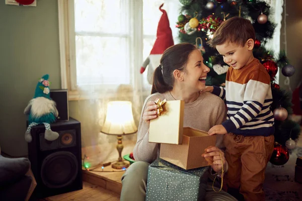 Cheerful Mother Her Small Boy Having Fun While Opening Gift — ストック写真