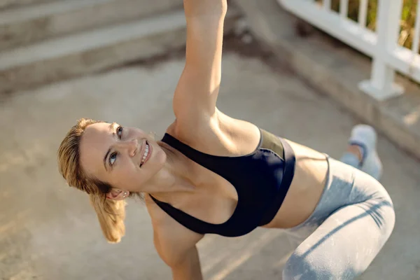 Smiling Female Athlete Doing Relaxation Exercises Outdoors — Stock Fotó