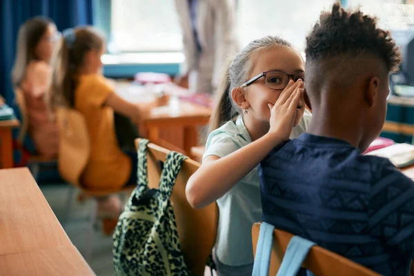 Little Girl Whispering Something Classmate Ear While Having Class School — 스톡 사진