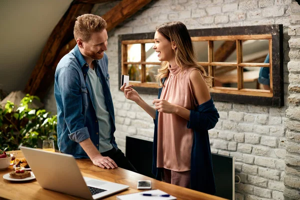 Young Happy Couple Communicating While Using Credit Card Home Shopping — Photo