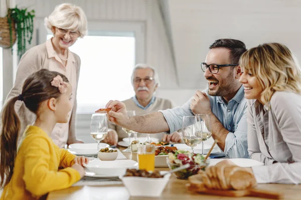 Multi Generation Family Having Fun Lunch While Father Feeding His — Foto Stock