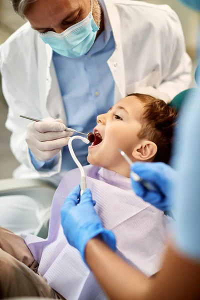 Little boy having dental examination during appointment at dentist\'s office.