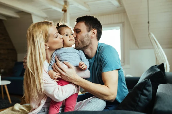 Young Loving Parents Kissing Small Daughter Cheek While Spending Time — Foto de Stock