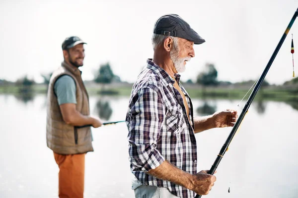 Mature Man His Adult Son Spending Time Together Fishing River — Stok fotoğraf