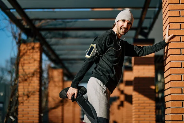 Young Happy Sportsman Warming Run Stretching His Leg Street — Foto de Stock