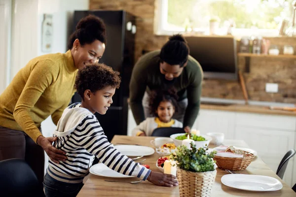 Happy African American Family Enjoying While Setting Dining Table Lunch — Foto de Stock