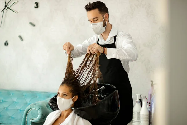 Young Hairdresser His Customer Wearing Protective Face Mask Hair Treatment — Zdjęcie stockowe