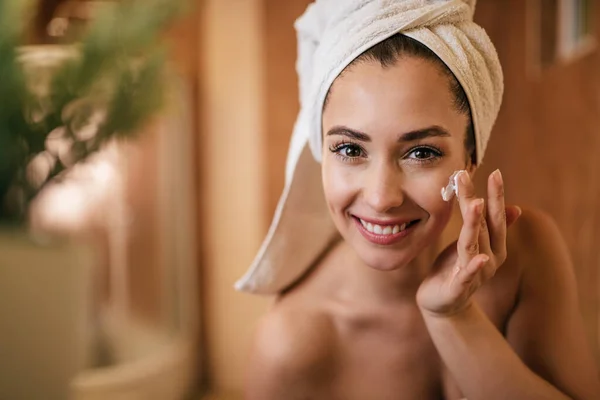 Young Beautiful Woman Applying Face Cream Bathroom — 스톡 사진