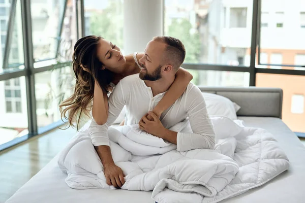 Happy Couple Love Embracing While Sitting Bed Communicating — Foto Stock