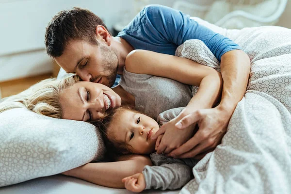 Young Happy Family Enjoying Morning While Lying Bed Together — Foto de Stock