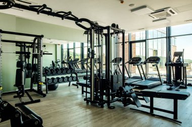 Exercise machines and equipment at health club with no people. 