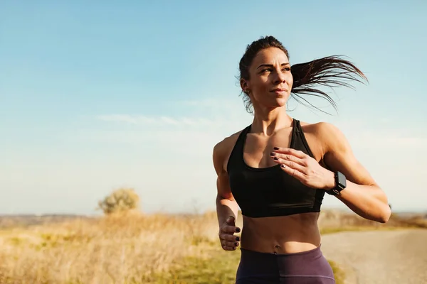 Young Motivated Athletic Woman Jogging Sports Training Nature Copy Space — Fotografia de Stock