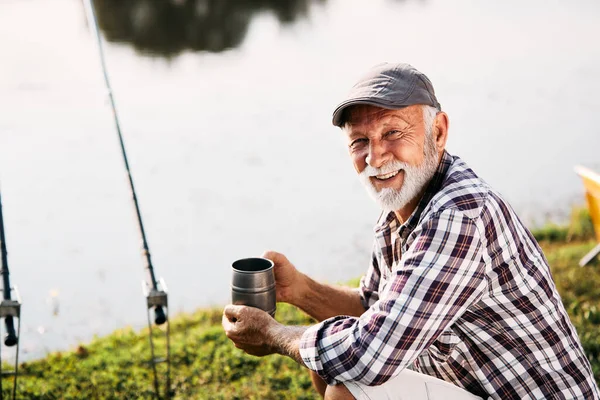 Happy Mature Man Enjoying While Fishing River Looking Camera — Stok fotoğraf