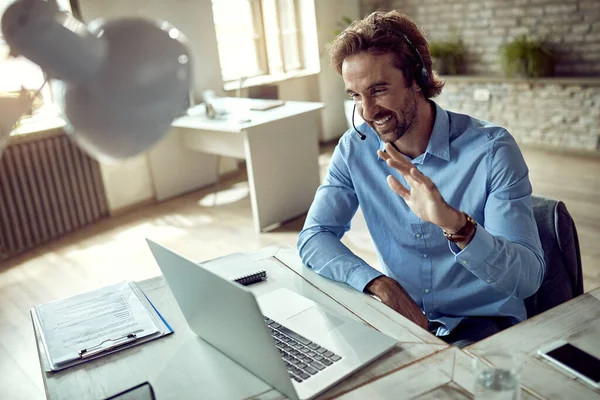 Happy Businessman Using Laptop Waving While Having Online Meeting His — Φωτογραφία Αρχείου