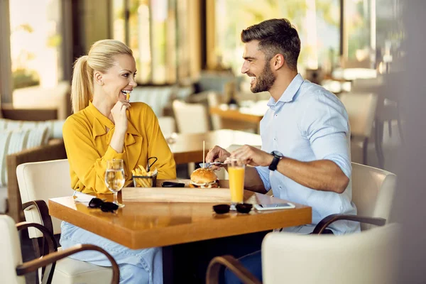 Happy Couple Having Fun While Eating Restaurant Talking Each Other — стоковое фото