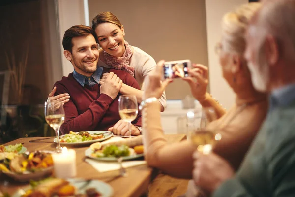 Happy Family Taking Pictures Smart Phone Dinner Dining Table Focus — Zdjęcie stockowe