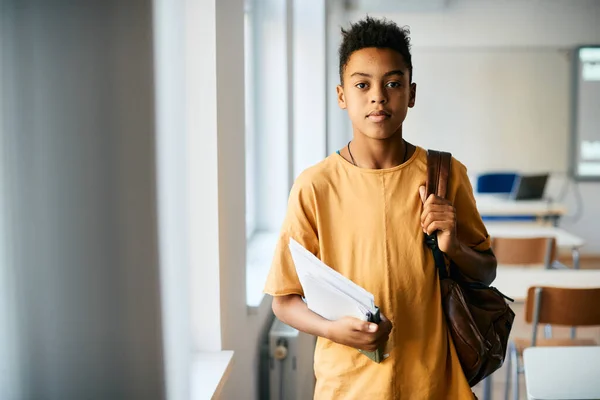 African American Elementary Student Books Backpack Standing Classroom Looking Camera — Foto de Stock