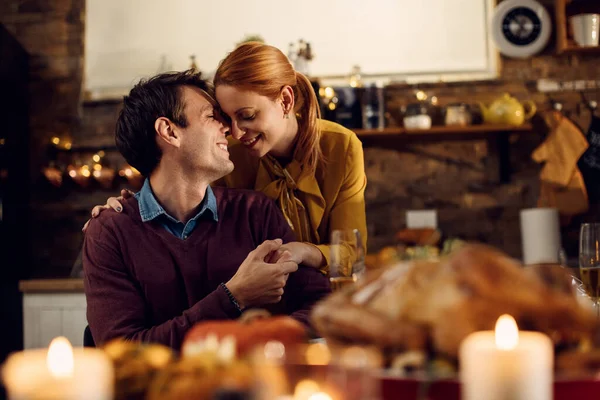 Loving Couple Showing Affection While Having Thanksgiving Meal Dining Room — стоковое фото