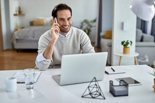 Young Happy Entrepreneur Communicating Mobile Phone While Working Laptop Home — Stockfoto