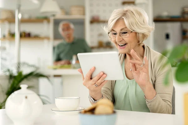 Happy Senior Woman Waving While Having Video Call Digital Tablet — Photo