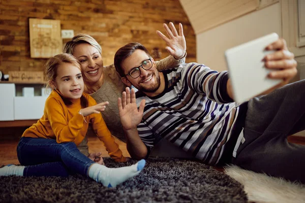 Happy Family Having Fun While Greeting Someone Video Call Home — Stock Fotó