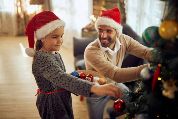 Happy Little Girl Enjoying Decorating Christmas Tree Her Father Home — ストック写真
