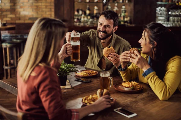 Young Happy Man Toasting Friends While Having Lunch Pub — Foto de Stock