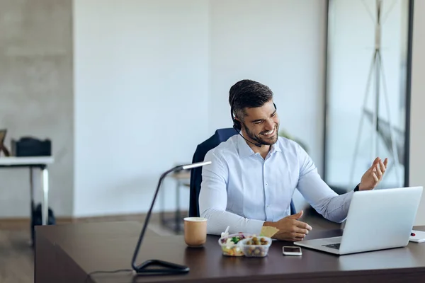 Young Happy Businessman Using Computer While Having Conference Call Office — Stockfoto