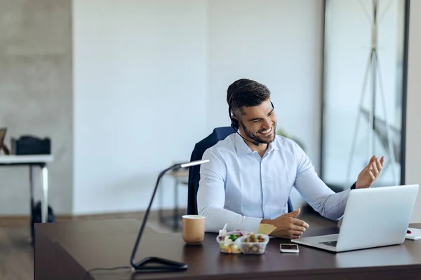 Young Happy Businessman Using Computer While Having Conference Call Office — Φωτογραφία Αρχείου