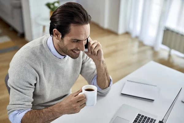 Young Happy Businessman Drinking Coffee Communicating Mobile Phone While Working — Stockfoto