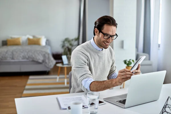 Happy Entrepreneur Using Computer While Working Business Reports Home — Stockfoto