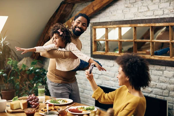 Happy Black Parents Having Fun Small Daughter Meal Dining Room — Foto de Stock