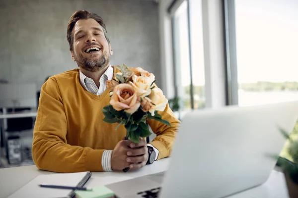 Happy Businessman Holding Bouquet Flowers While Having Video Call Laptop — Φωτογραφία Αρχείου
