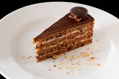 Layer chocolate cake with walnuts.  